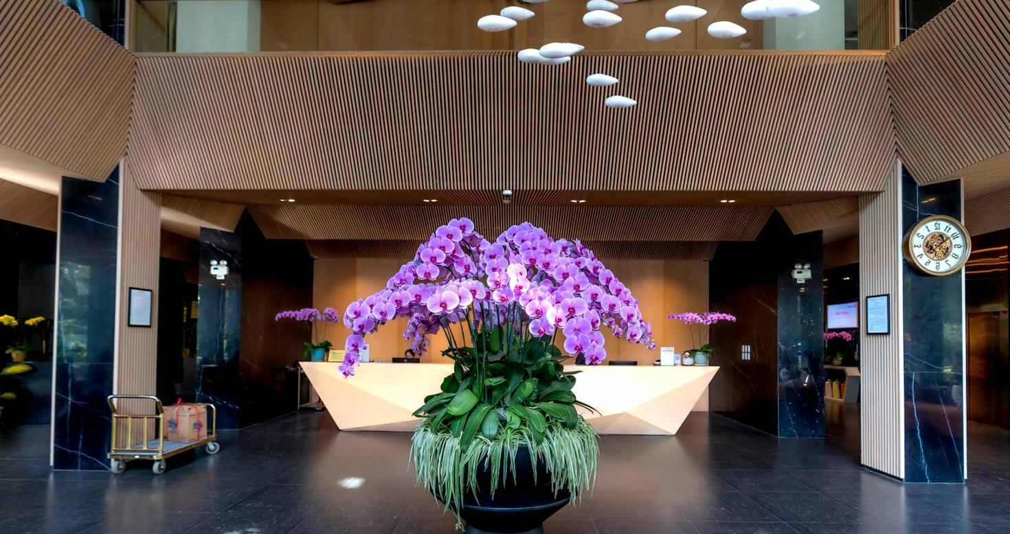Hotel reception desk with orchids
